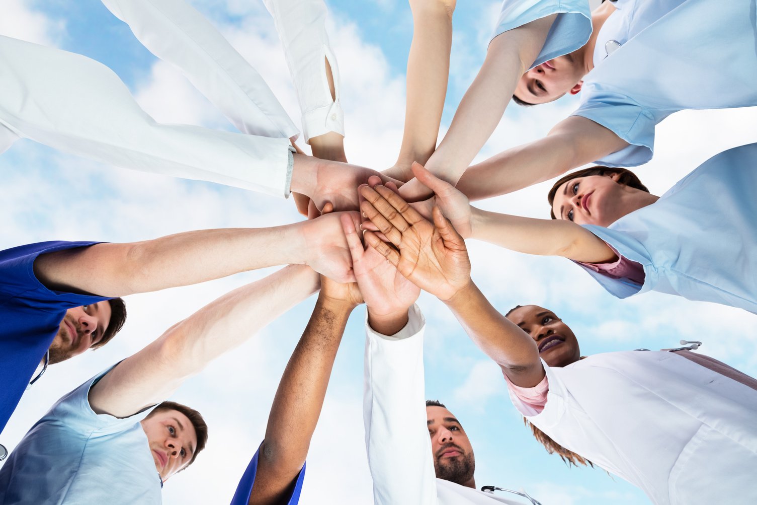 Diverse Medical Team Staff Hands Stack